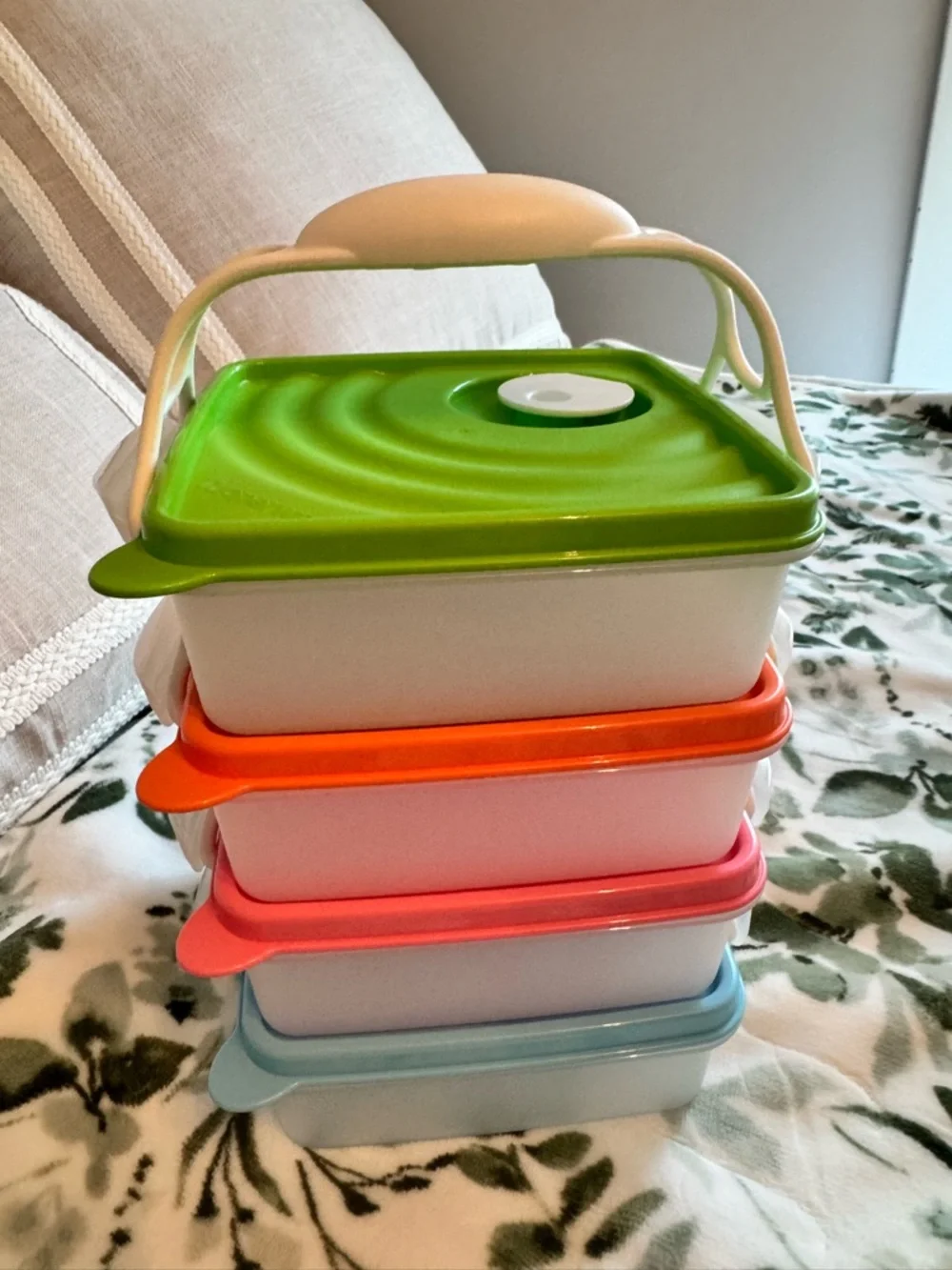 Tupperware Stacked food storage containers with carrier handle